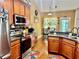 Kitchen with stainless steel appliances, granite counters, and cozy breakfast area at 1902 Commons View Cir, Snellville, GA 30078