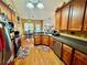 Well-lit kitchen featuring wood cabinets, stainless steel appliances, granite counters, and a cozy breakfast area at 1902 Commons View Cir, Snellville, GA 30078
