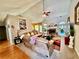 Cozy living room with vaulted ceiling, hardwood floors, large sofa, and fireplace at 1902 Commons View Cir, Snellville, GA 30078