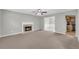 Spacious living room with a cozy fireplace and an open layout that flows into the dining area and kitchen at 4092 Arabian Way, Snellville, GA 30039