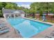 Inviting community pool with lounge chairs, perfect for relaxation and enjoyment at 4092 Arabian Way, Snellville, GA 30039
