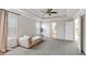 Bedroom featuring neutral walls, tray ceiling, lots of natural light, and seating area at 90 Citrine Way, Acworth, GA 30101