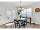 Bright dining area with wood floors, modern lighting and access to the outdoor space at 90 Citrine Way, Acworth, GA 30101