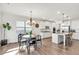 Open kitchen layout with a large island, stainless steel appliances and an adjacent dining area at 90 Citrine Way, Acworth, GA 30101