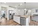 Gourmet kitchen with stainless appliances, granite counters, and a large island with seating at 90 Citrine Way, Acworth, GA 30101