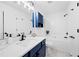 Bathroom featuring a blue vanity, tub and shower combination, and modern fixtures at 132 Timber Mist Ln, Lawrenceville, GA 30045