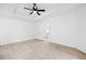 Large bedroom features ceiling fan, carpet and a door to a possible ensuite bathroom at 132 Timber Mist Ln, Lawrenceville, GA 30045