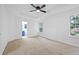 Large main bedroom featuring carpet, a ceiling fan, and views of an ensuite bath at 132 Timber Mist Ln, Lawrenceville, GA 30045