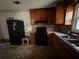 View of the kitchen featuring appliances and wood cabinets at 2369 Christian Cir, Covington, GA 30016
