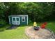 Backyard featuring a shed and a seating area at 511 Reid St, Villa Rica, GA 30180