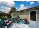 Backyard with patio seating, stairs and lush foliage at 511 Reid St, Villa Rica, GA 30180