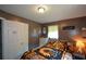 The bedroom includes a floral bedspread, white door, and a light fixture at 511 Reid St, Villa Rica, GA 30180