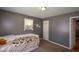Neutral bedroom featuring wall decor, carpet floors and a window AC unit at 511 Reid St, Villa Rica, GA 30180