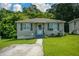 Well-kept single-story home with a neat lawn, inviting entrance, and a welcoming atmosphere at 511 Reid St, Villa Rica, GA 30180