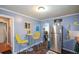 Kitchen area with stainless steel refrigerator, yellow chairs, and unique tile flooring at 511 Reid St, Villa Rica, GA 30180