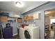The laundry room includes the washer and dryer, storage cabinet, and wire shelving at 511 Reid St, Villa Rica, GA 30180