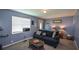 Comfortable living room with neutral tones and ample natural light from a large window at 511 Reid St, Villa Rica, GA 30180