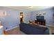 Comfortable living room with plush seating and a view into the adjacent kitchen at 511 Reid St, Villa Rica, GA 30180
