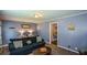 Cozy living room featuring comfortable seating and a view to the adjacent dining area at 511 Reid St, Villa Rica, GA 30180