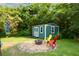 Backyard featuring a shed with a seating area at 511 Reid St, Villa Rica, GA 30180