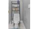 Cozy bathroom with modern toilet and a convenient storage rack at 530 Georgian Hills Dr, Lawrenceville, GA 30045