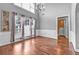 Bright dining room with large windows, wainscoting, and hardwood floors at 530 Georgian Hills Dr, Lawrenceville, GA 30045