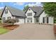 Spacious home featuring a wide driveway and inviting two-car garage at 530 Georgian Hills Dr, Lawrenceville, GA 30045
