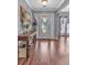 Inviting foyer with hardwood floors, elegant decor, and lots of natural light at 530 Georgian Hills Dr, Lawrenceville, GA 30045