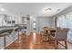 Eat-in kitchen with modern bar seating and plenty of natural light at 530 Georgian Hills Dr, Lawrenceville, GA 30045
