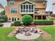 Backyard featuring a fire pit and outdoor seating area at 1346 Wind Chime Ct, Lawrenceville, GA 30045