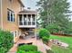 Backyard featuring deck, patio, firepit and screened-in porch at 1346 Wind Chime Ct, Lawrenceville, GA 30045
