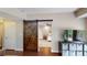 Bedroom with hardwood floors, barn door, recessed lighting, and ceiling fan at 1346 Wind Chime Ct, Lawrenceville, GA 30045