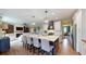 Kitchen boasts an island, pendant lights, and an open view to the living area at 1346 Wind Chime Ct, Lawrenceville, GA 30045