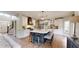 Spacious kitchen with an island, white cabinetry, stainless steel appliances, and hardwood floors at 1346 Wind Chime Ct, Lawrenceville, GA 30045