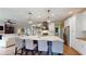 Open kitchen featuring a center island, modern lighting, and stainless steel appliances at 1346 Wind Chime Ct, Lawrenceville, GA 30045