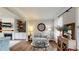 Cozy living room featuring hardwood floors, built-in shelving, and ample natural light perfect for entertaining at 1346 Wind Chime Ct, Lawrenceville, GA 30045