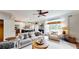 Bright and airy living room featuring an open layout, hardwood floors, and seamless access to the kitchen at 1346 Wind Chime Ct, Lawrenceville, GA 30045