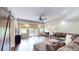 Open living room featuring a comfortable sofa, recessed lighting and sliding glass doors at 1346 Wind Chime Ct, Lawrenceville, GA 30045