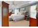 Spacious main bedroom with trey ceilings, neutral carpet and large windows at 1346 Wind Chime Ct, Lawrenceville, GA 30045