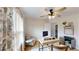 Office featuring stylish desk, neutral chair, floral curtains, ceiling fan and decor at 1346 Wind Chime Ct, Lawrenceville, GA 30045