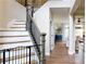 Staircase featuring neutral walls, wood treads, and natural light offering a blend of style and functionality at 1346 Wind Chime Ct, Lawrenceville, GA 30045