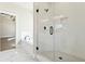 The luxurious glass enclosed shower features white tile and black accents at 2080 Cactus Ln, Cumming, GA 30040