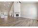 Bright open space features wood floors, a fireplace, tall ceilings and neutral walls at 2080 Cactus Ln, Cumming, GA 30040