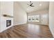 This open concept space features wood floors, a fireplace, tall ceilings, and natural light at 2080 Cactus Ln, Cumming, GA 30040