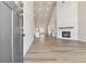 Bright, open floor plan with hardwood floors, fireplace, tall ceilings, and views of the kitchen at 2080 Cactus Ln, Cumming, GA 30040