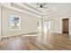 Large main bedroom with tray ceiling, windows, and ensuite bathroom with sliding barn door at 2080 Cactus Ln, Cumming, GA 30040
