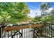 Apartment balcony featuring beautiful floral planters and peaceful views of nature at 2277 Peachtree Ne Rd # 302, Atlanta, GA 30309