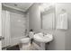 Modern bathroom with subway tile shower and pedestal sink at 2277 Peachtree Ne Rd # 302, Atlanta, GA 30309