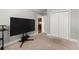 Neutral carpeted bedroom with a television and closet at 2277 Peachtree Ne Rd # 302, Atlanta, GA 30309
