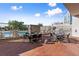 Outdoor dining area features patio stone, a pool, and wrought-iron tables and chairs at 2277 Peachtree Ne Rd # 302, Atlanta, GA 30309
